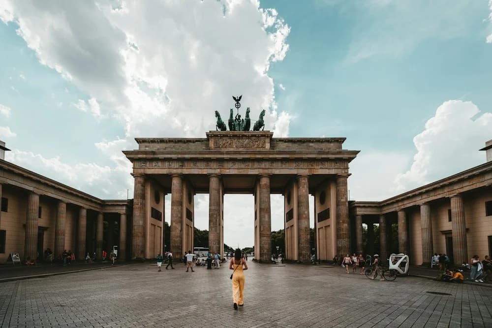 The Brandenburg Gate in Berlin under a blue sky